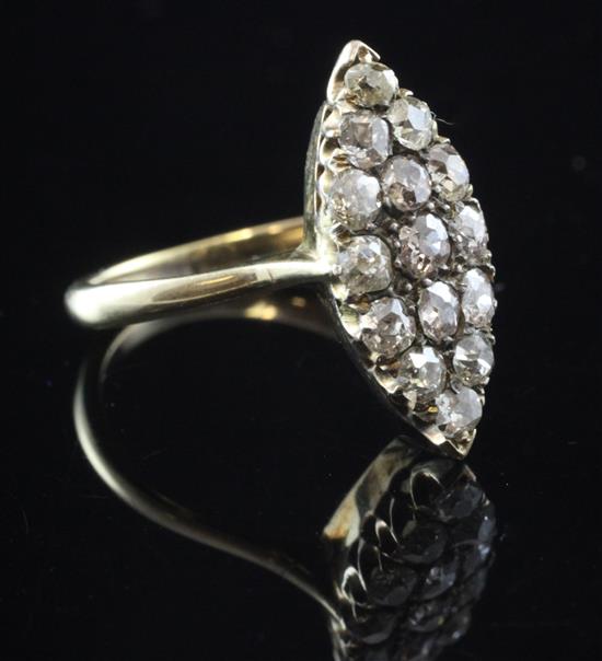 An early 20th century gold and diamond marquise shaped ring, size L.